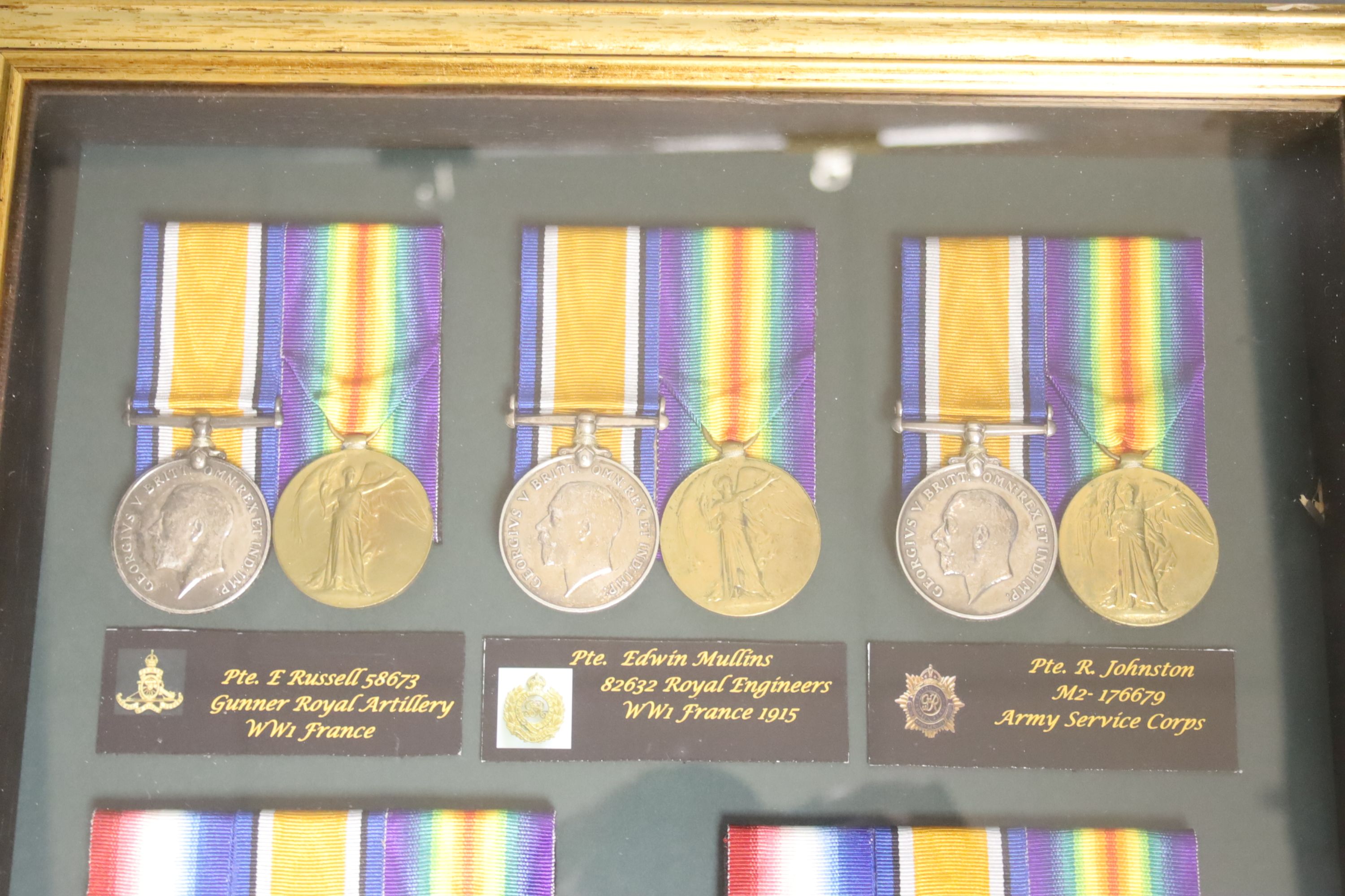 Five WW1 medal groups in one display case